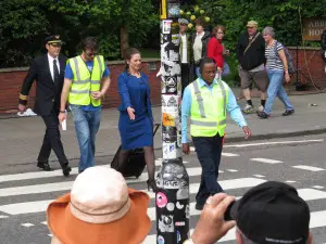 Actors have dressed up for an airline commercial walking across Abbey Road
