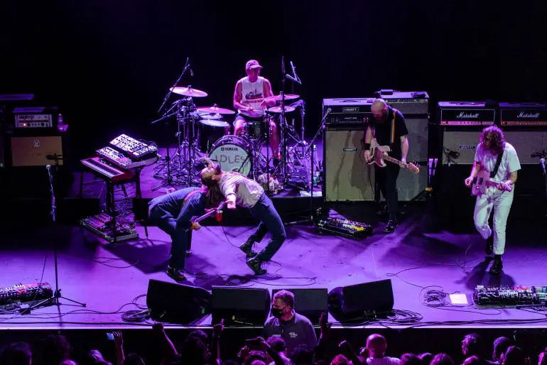 Idles performing onstage in San Francisco.